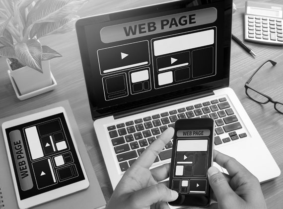 dynamic website design MacBook iPhone iPad phone tablet laptop grayscale black and white
