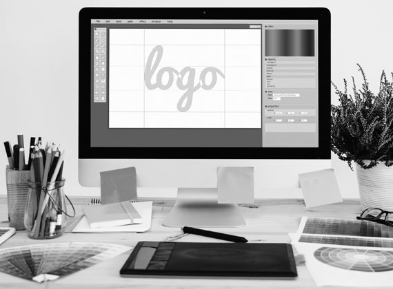 designing logo office desk iMac pens pencils color colour charts grayscale black and white